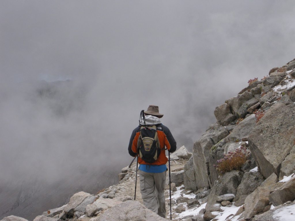 Richard Uzelac Hiking Mt Whitney at 13,500 feet in the snow and granite